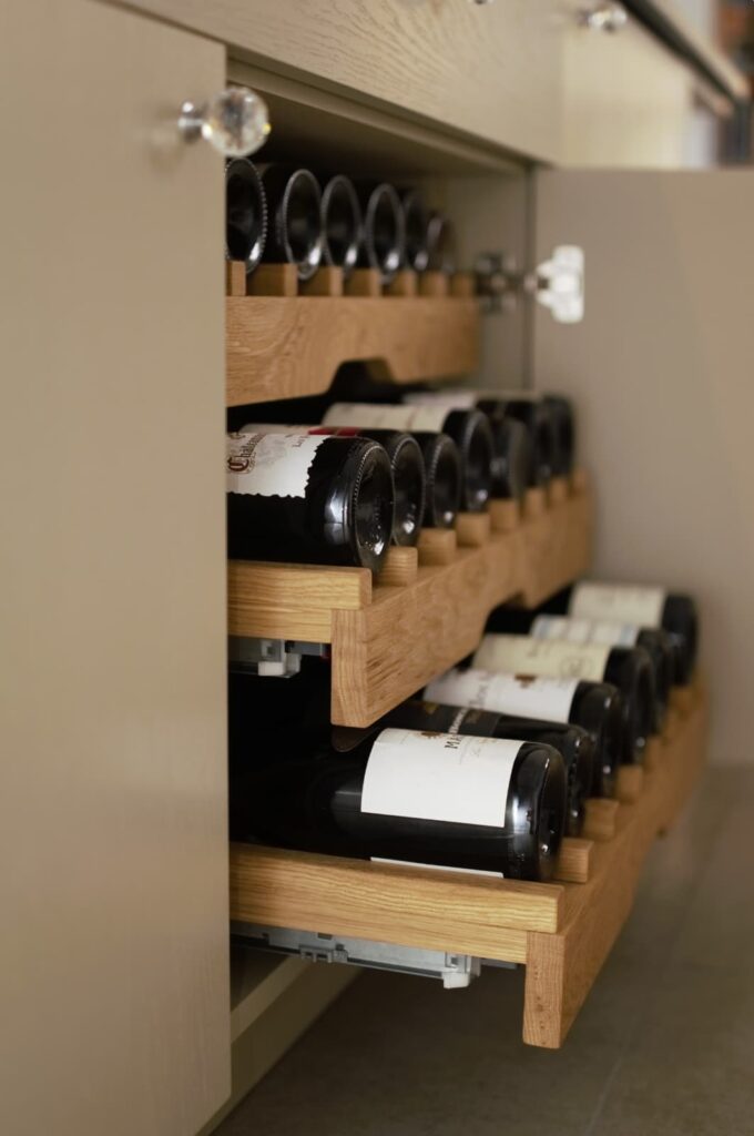 Pull-out bottle racks within the Kildare home bar cabinetry