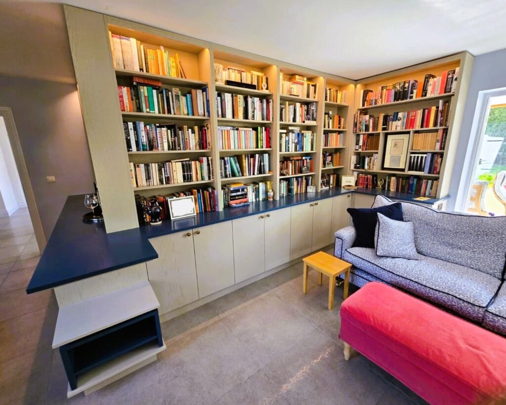 Bespoke library shelving and blue surfaces in a Kildare home