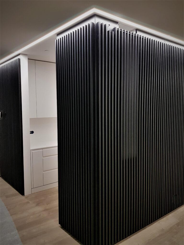 dark fluted wardrobe doors by Beproje