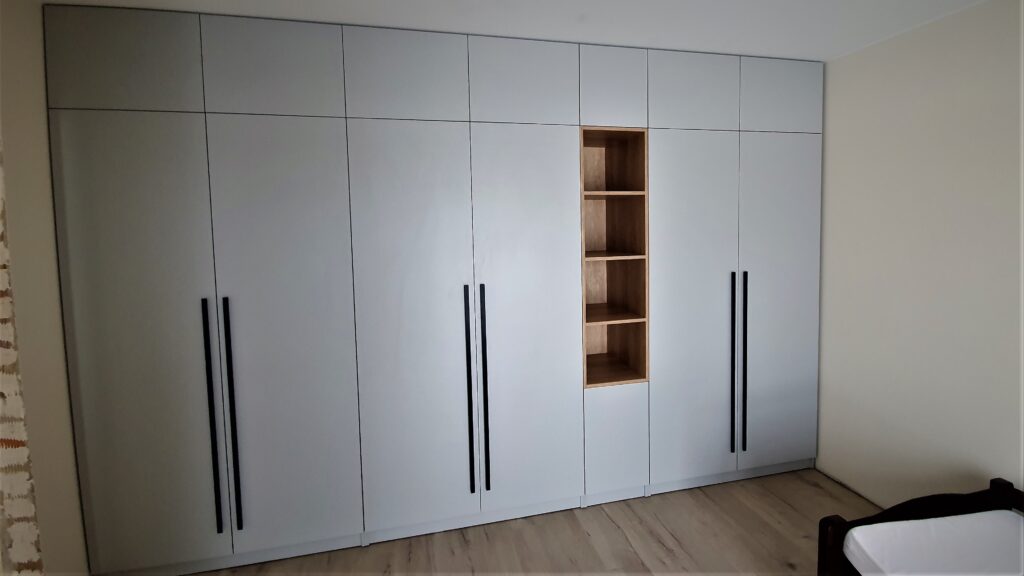 white wardrobes with open display shelving by Beproje