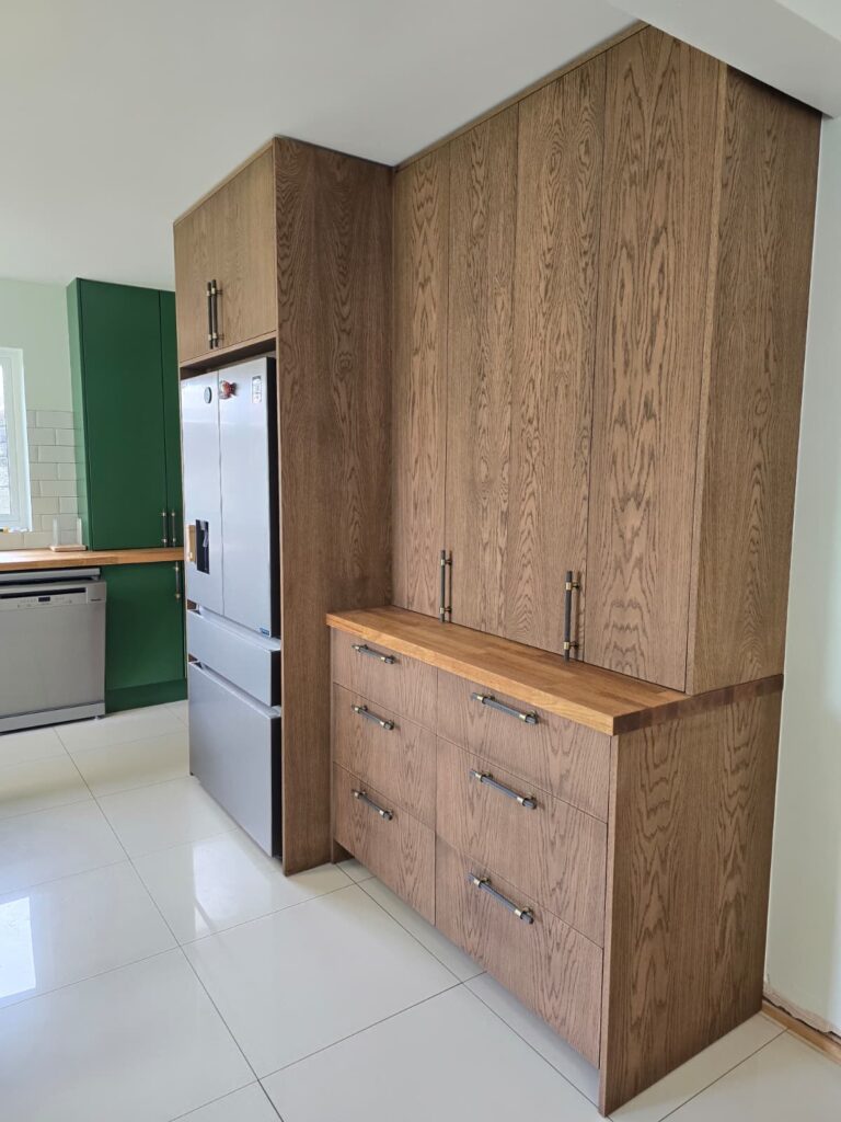 Handmade oak-veneered furniture with dark Jacobean finish in Trim: completed unit side view